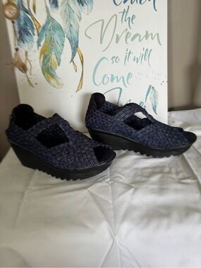 Bernie Merv open toe wedge shoe.